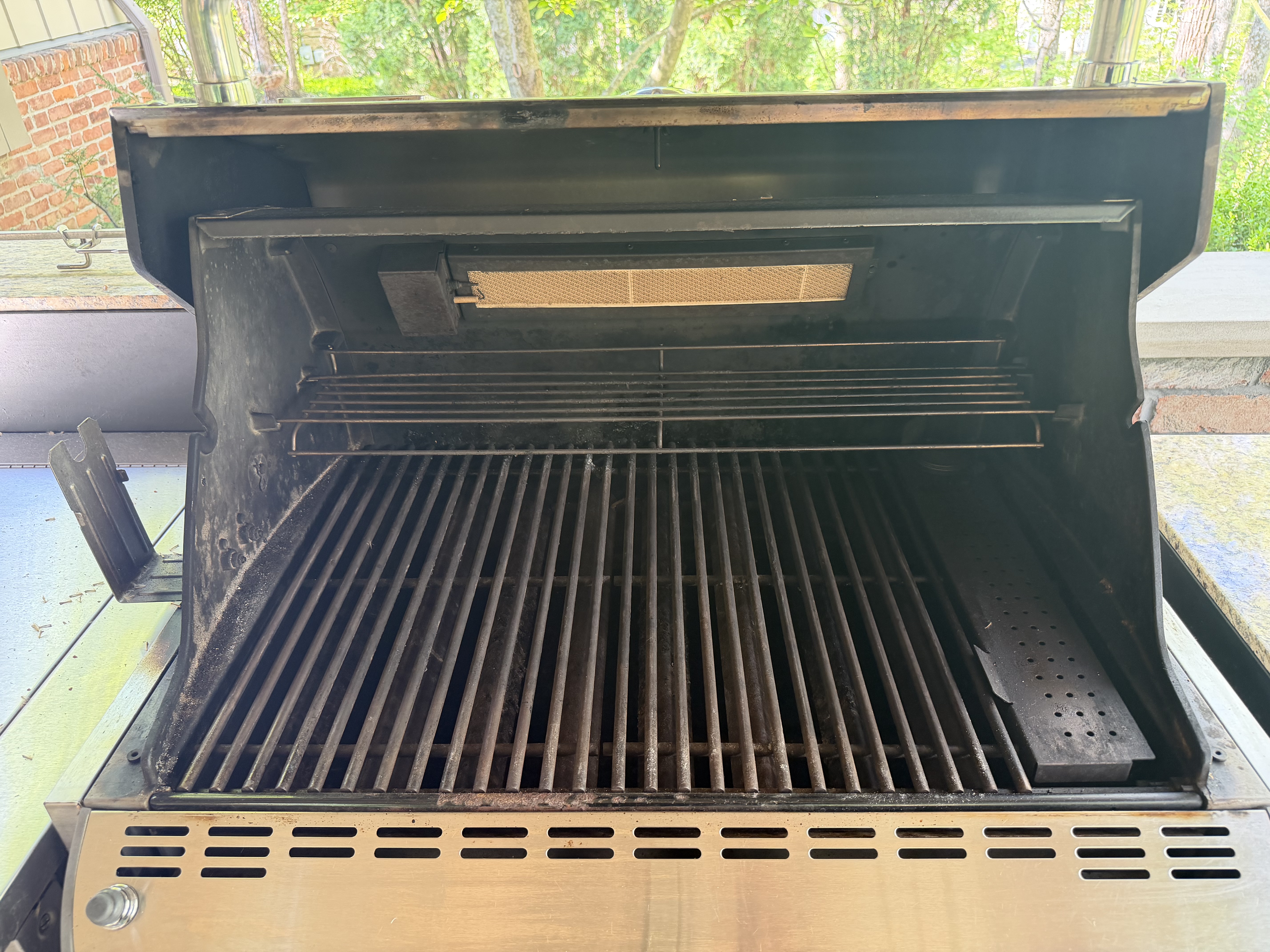 Before: a 5-burner gas grill with grease and soot across the cookbox and grates